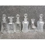 Six cut glass decanters and four labels whisky, gin, vodka and brandy.