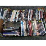 Box containing 65 mixed genre DVDs including Magnificent seven 4 film boxset