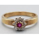 Ladies 9ct yellow gold ruby and diamond cluster ring 2.5g gross size M