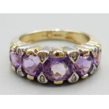 Ladies 9ct yellow gold purple stone and diamond ring 3.5g gross size I 1/2