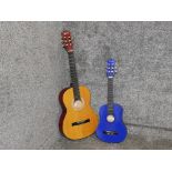 Encore acoustic guitar and a childs blue guitar