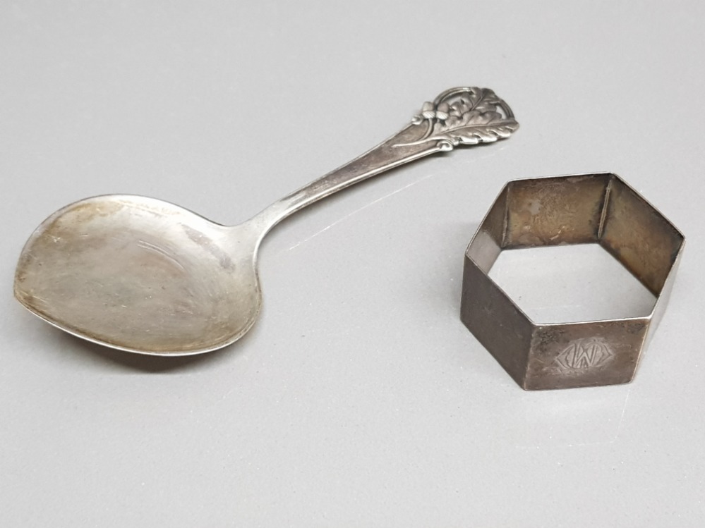 A silver napkin ring hallmarked for Birmingham, and a continental silver spoon with oak leaf and