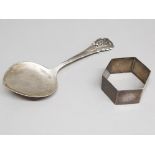 A silver napkin ring hallmarked for Birmingham, and a continental silver spoon with oak leaf and