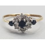 Ladies 9ct yellow gold sapphire & diamond cluster ring, featuring 3 round sapphires & 6 round