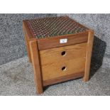 An oak two drawer stool with leather top