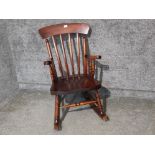 A 19th century style rocking chair.