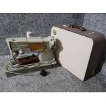 A singer sewing machine in fitted case