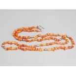 Cornelian long bead necklet with silver tag