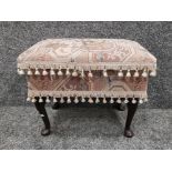 Fringed & upholstered footstool with mahogany foot supports