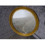 An oval bevelled wall mirror by A W Morris Ltd (reproduction) 68.5 x 59.5 cm
