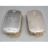 A pair of silver backed hair brushes hallmarked for Birmingham