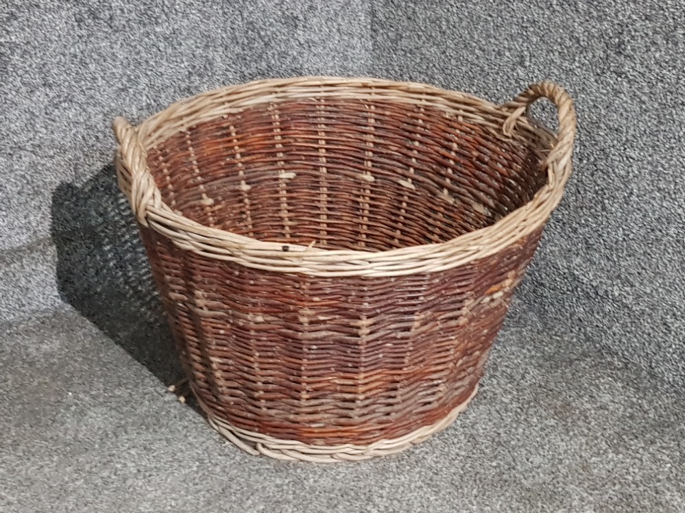 A two tone wicker log basket