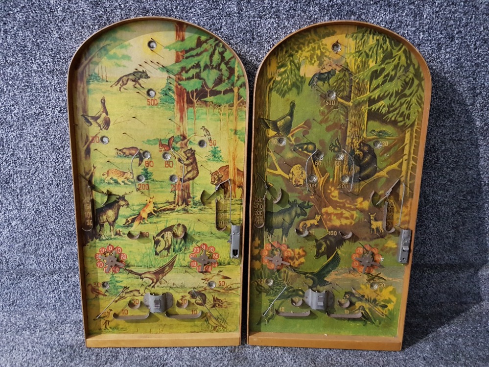 A pair of bagatelle boards with forest animal decorations