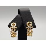 A pair of ladies 18ct yellow gold ornate diamond flower earrings 5.7g gross