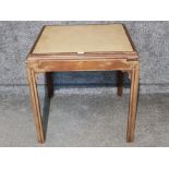An edwardian oak card table with lift up top and pull out drink holders to the corners