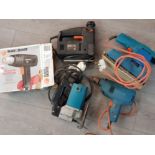 Crate containing miscellaneous electric tools including jigsaw, power drill, Black & decker heat gun