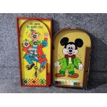 A Mickey Mouse bagatelle board and a clown bagatelle board