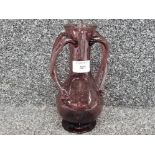 A hand blown amethyst glass vase with twisted twin handles 20.5cm high