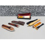 A collection of cheroots to include a meerschaum and white metal mounted one, in fitted case.