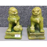 A pair of Chinese green glazed pottery dog of Foo 21cm high