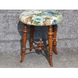 Antique stool with centre decorated stretchers and flared feet