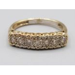 9ct gold diamond 7 stone ring. Approx 1ct 2.6g size N