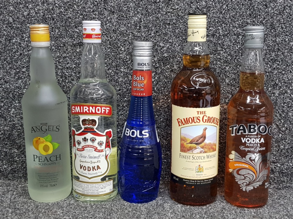 5 bottles of alcohol including The famous Grouse whisky, Smirnoff vodka, Angels peach schnapps,