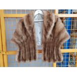 A blonde mink fur stole with collar.