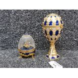 Two faberge style music boxes, one with glass dome