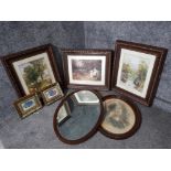 An Edwardian inlaid mahogany oval wall mirror together with six colour prints