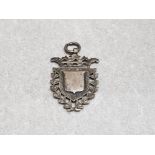 An extraordinary ornate solid silver fob with blank shields to front and back 11.3g