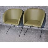 Pair of dark green leatherette tub chairs on chrome effect leg supports