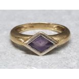 9ct yellow gold ring with purple diamond shaped centre stone, size M½, 2.7g gross