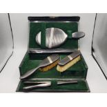 Boxed vintage 4 piece dressing table set includes hairbrush, mirror, glove stretchers and one