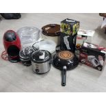 Large box containing miscellaneous kitchen items including Tefal pan, slow cookers, coffee machine