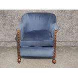 Blue upholstered metal studded armchair