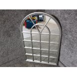 A modern domed wall mirror with silver coloured frame 91 x 60cm