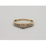 Ladies 9ct yellow gold diamond ring comprising of a brillaint round cut diamond set in the centre