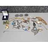 Five pandora style bracelets, brooches, three Elizabeth II coins etc