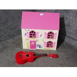 A modern dolls house and a Ready Ace ukulele