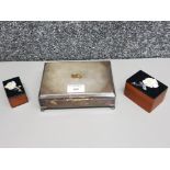 A silver plated cigar or cigarette box by Aristocrat, and two seashell and wooden trinket boxes by