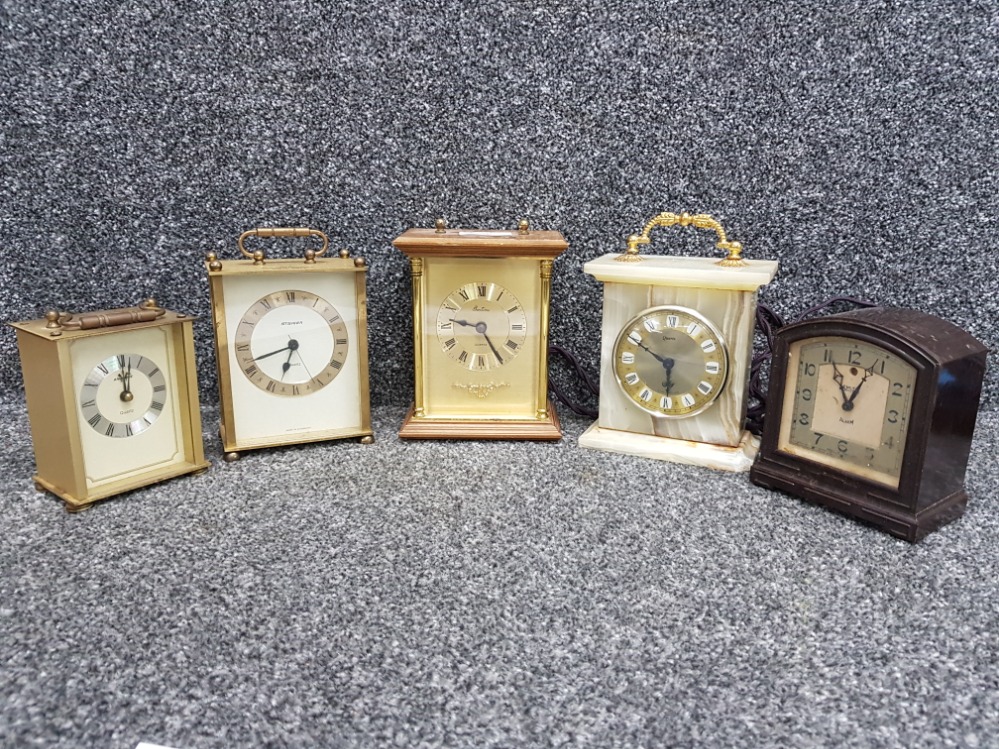 A lot of four brass and other carriage clocks and Smiths Electra bakelite electric clock