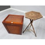 A bamboo octagonal occasional table and a wooden and wicker linen basket
