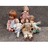 A collection of old porcelain dolls includes reproduction of boots Tyne 1992 etc