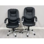 A pair of black leather effect swivel office chairs