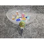 A glass bowl containing Murano glass cork and vintage Murano sweets