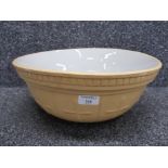 A large glazed pottery mixing bowl by Wearside pottery dated 1945