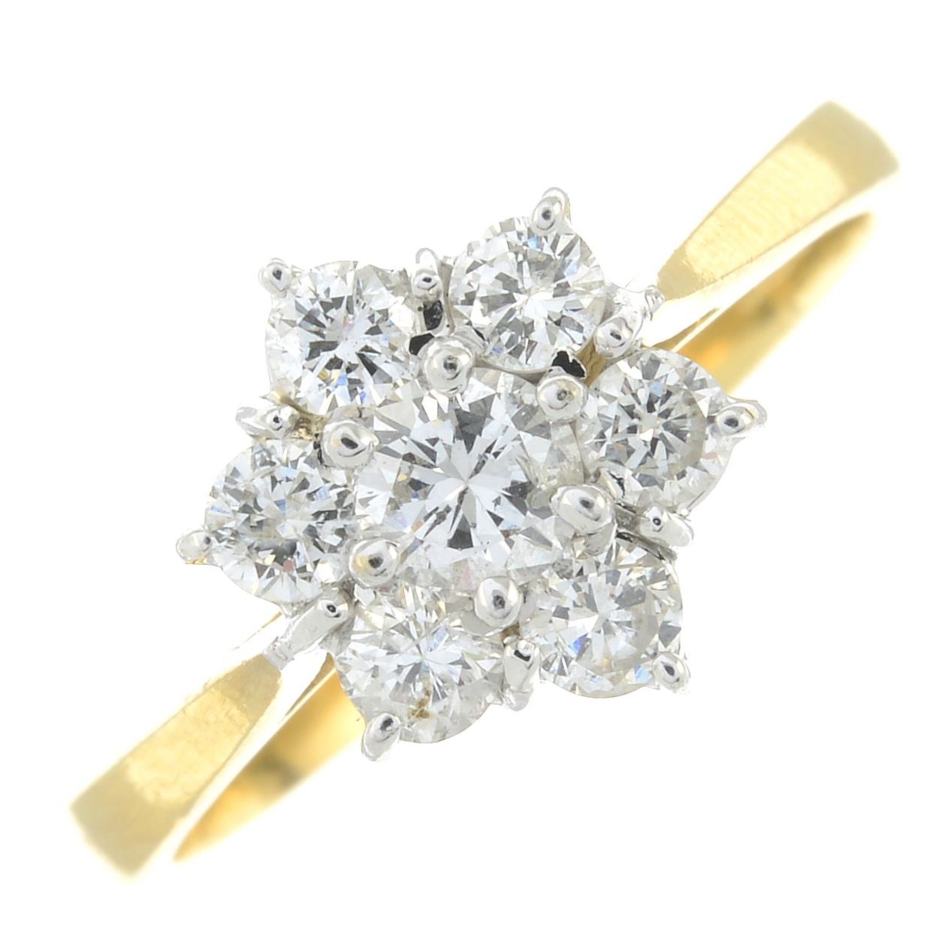 An 18ct gold diamond cluster ring.Estimated total diamond weight 0.55ct,