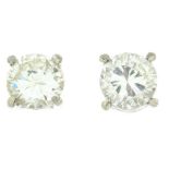 A pair of 9ct gold diamond stud earrings.Estimated total diamond weight 0.70ct,
