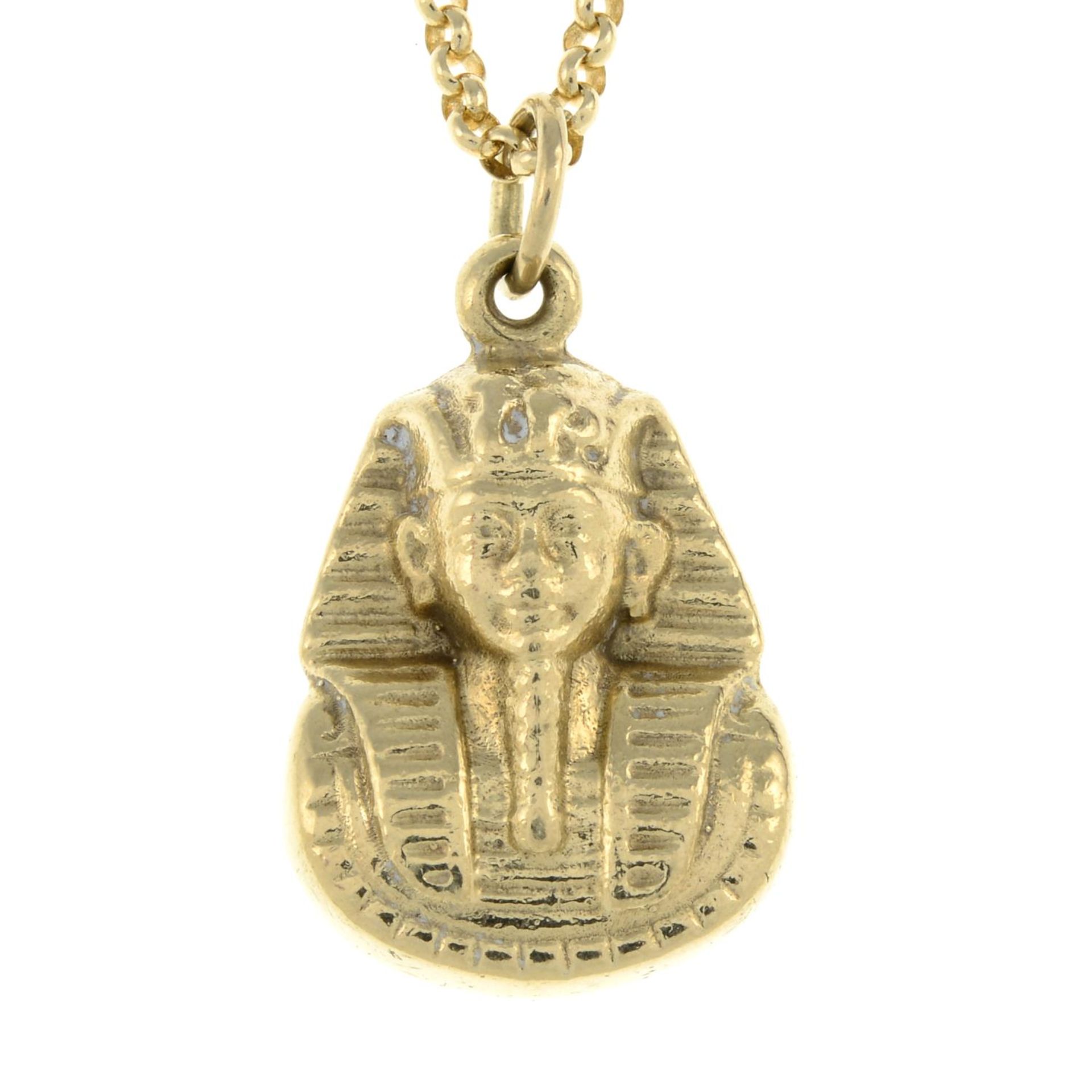 A pendant, designed to depict a Pharaoh's bust,